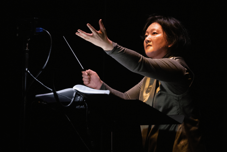 Kanako Abe conducting Woman at Point Zero on stage